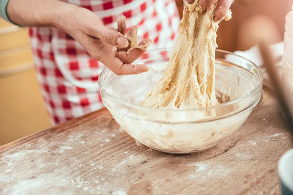 Woman kneading pizza dough — Stock Photo, Image