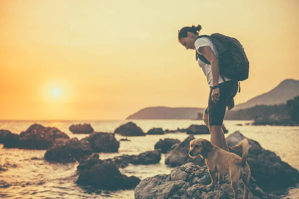 Woman with dog hiking — Stock Photo, Image