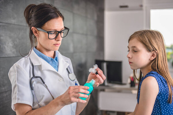 Doctor cleaning arm with alcohol