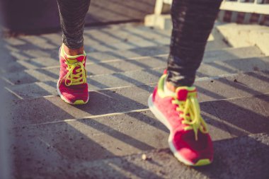 runner shoes on concrete stairs