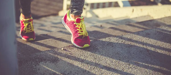 runner shoes on concrete stairs