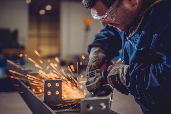 Worker throwing sparks