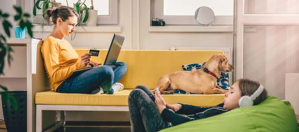 Woman Wearing Yellow Sweater Sitting Yellow Sofa Home Shopping Online — Stock Photo, Image