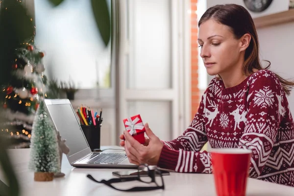 Woman opening gift box