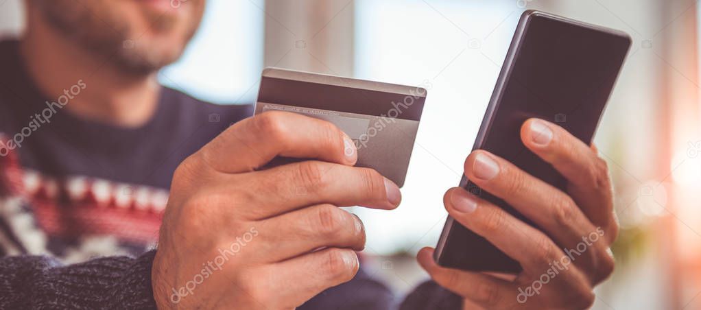 Man shopping online with smartphone