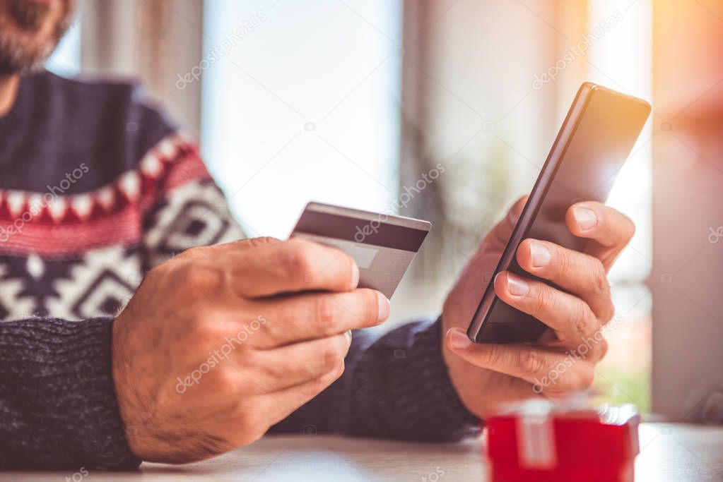 Man shopping online with smartphone