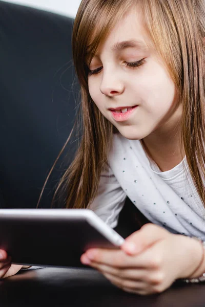 close-up of Girl reading messages on tablet