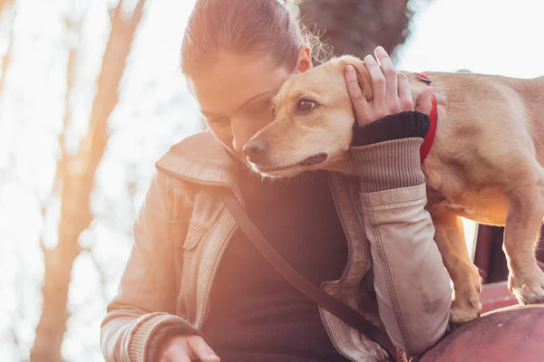 Woman Gently Hugging Her Pet Dog — Stock Photo, Image