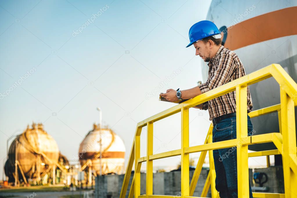Man making report  in natural gas factory