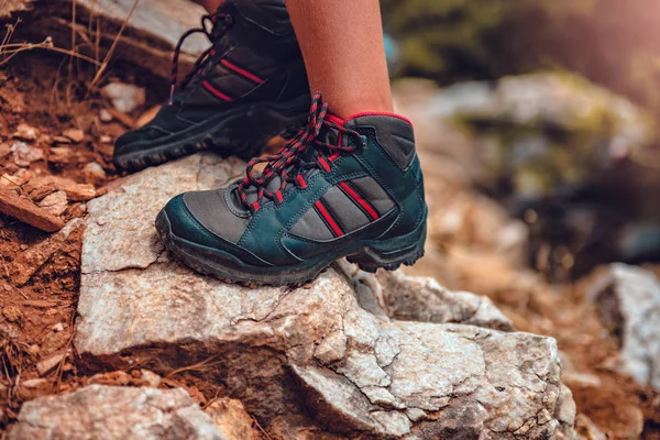 Hikers boots on rock — Stock Photo, Image