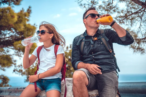 Father and daughter resting after long walk Stock Image