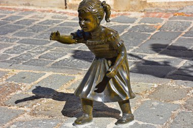 Italy, Basilicata region, 10/10/2017, bronze sculpture on the sidewalk of the city of Melfi.