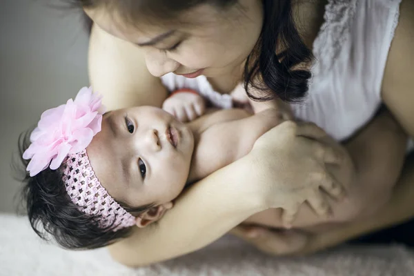 Mother holding her little baby girl — Stock Photo, Image