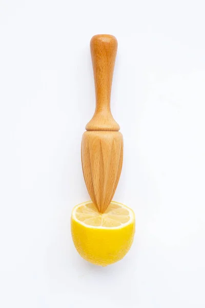 Fresh lemon with wooden juicer on white background. — Stock Photo, Image