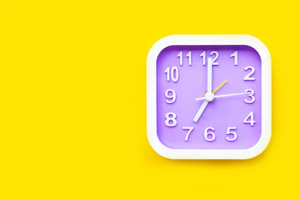 Clock on yellow background. — Stock Photo, Image