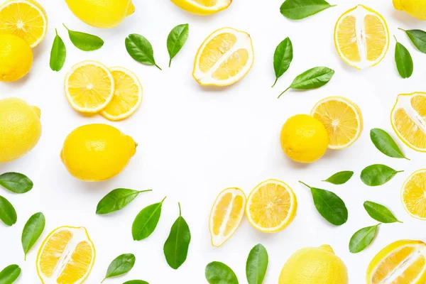 Fresh lemon with green leaves on white. — Stock Photo, Image