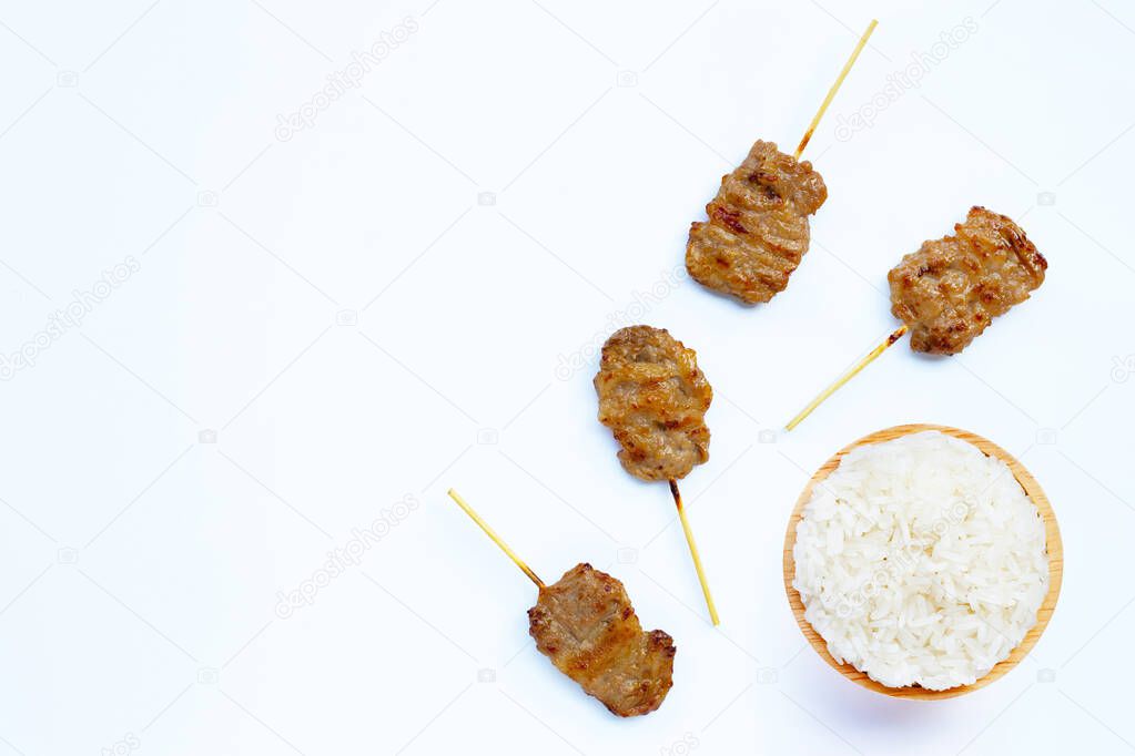 Grilled pork with sticky rice on white background. Copy space