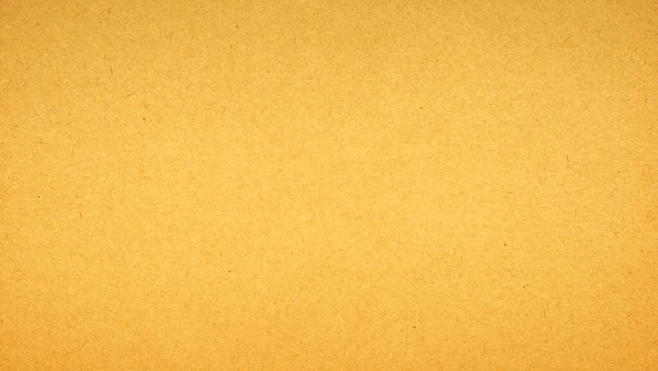 Sheet of brown paper or cardboard texture for background.