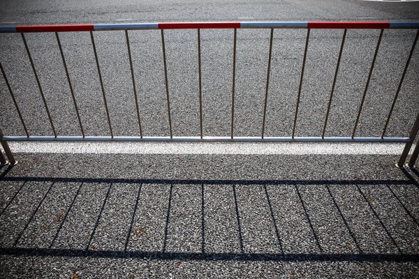 Steel with shadows from the sun in the parking lot. — Stock Photo, Image