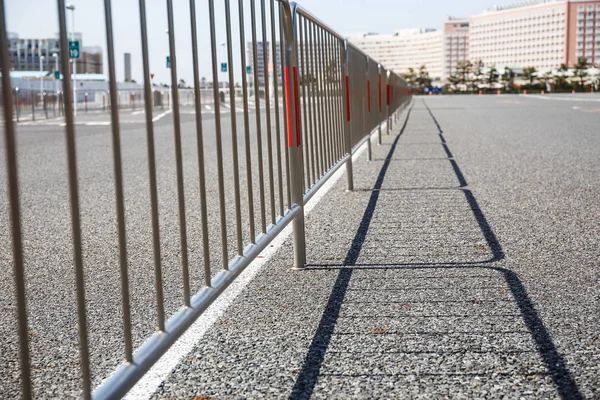 Steel with shadows from the sun in the parking lot. — Stock Photo, Image