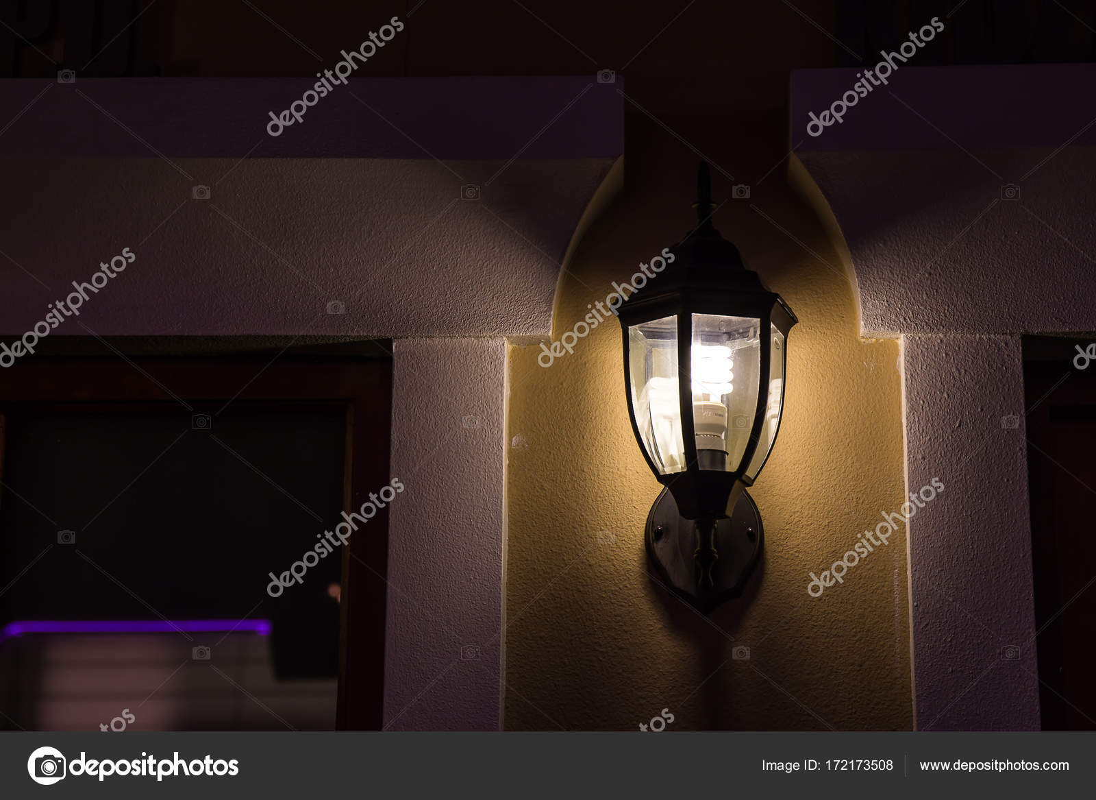 The Wall Lamp Is On Fire At Night Stock Photo Photonewman The Wall Lamp Is On Fire At Night Stock Photo