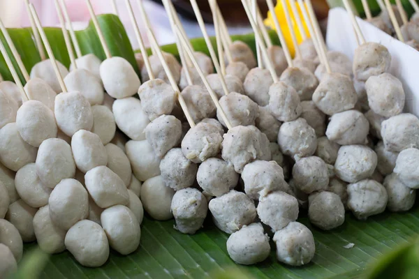 Pork balls in a wooden tray in a tray with a banana leaf. — Stock Photo, Image