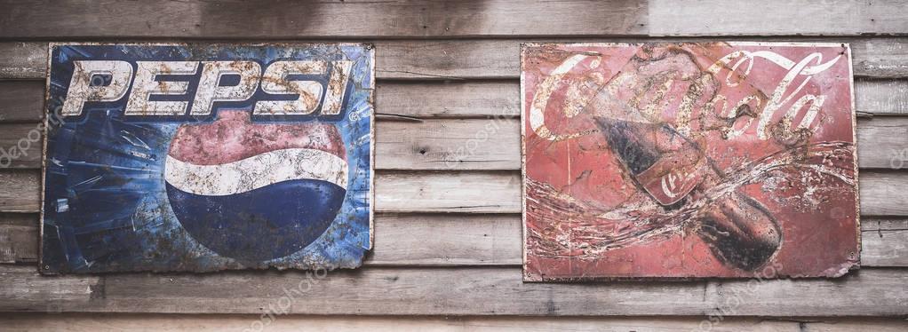 BANGKOK -THAILAND, September 3,2017 : Old condition vintage wall of Coca-Cola and Pepsi logo at museum  Ban Bang Khen in Bangkok Thailand.