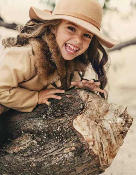Little girl in a hat with long hair — Stock Photo, Image