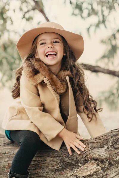 Little girl in a hat with long hair — Stock Photo, Image