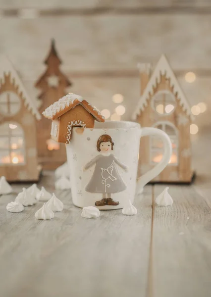 white mug with gingerbread house