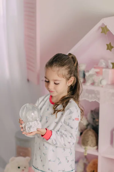 Girl in pajamas in the children's room — Stock Photo, Image