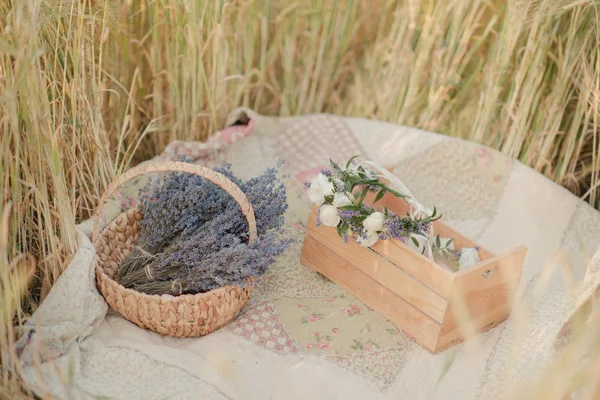 Basket with lavender on a wheat field — Stock Photo, Image
