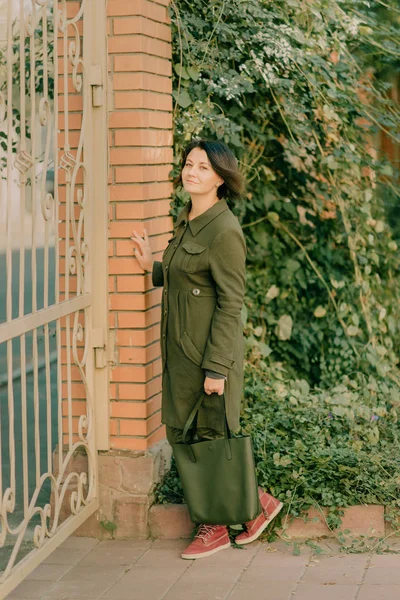Girl in green coat — Stock Photo, Image