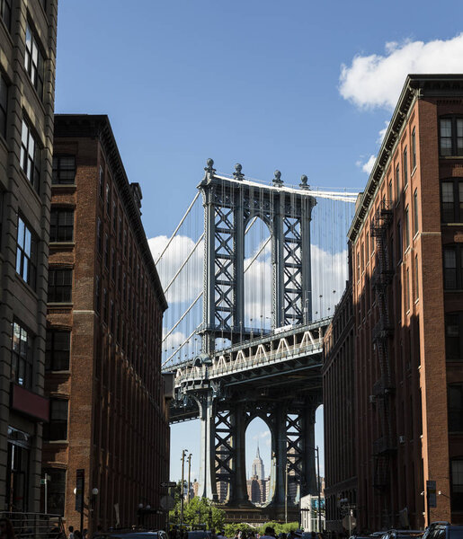 Brooklyn City street showing Manhattan Bridge from front street