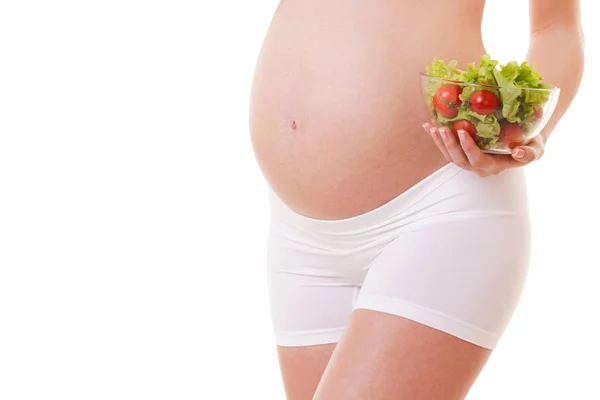 Gezonde voeding van de zwangere vrouw. Witte achtergrond. Close-up. Moederschap, zwangerschap, mensen en verwachting concept. Zwangere vrouw verwacht baby — Stockfoto