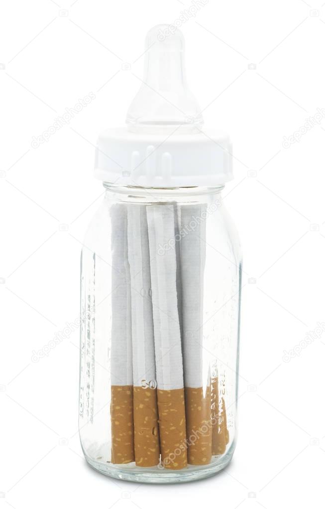 Pregnancy Smoking.Baby Bottle With Cigarettes