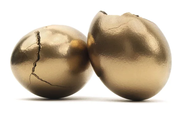 Huevos Dorados Rotos Sobre Fondo Blanco —  Fotos de Stock