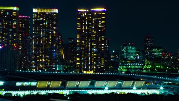 Un lapso de tiempo nocturno del paisaje urbano en la ciudad urbana de Ariake Tokio — Vídeos de Stock