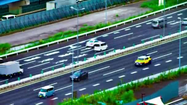 Un timelapse de la calle de la ciudad en la ciudad urbana en Ariake Tokio diurno largo tiro — Vídeos de Stock