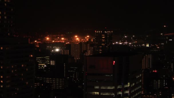 Uma paisagem urbana noturna em Shinagawa Tóquio tiro longo ângulo alto — Vídeo de Stock