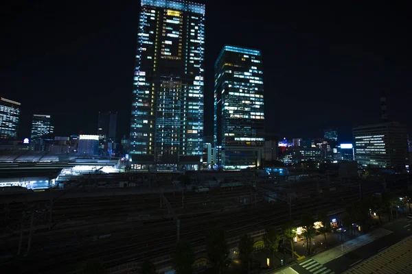 Uma paisagem urbana noturna na cidade de negócios em Tóquio tiro grande ângulo alto — Fotografia de Stock