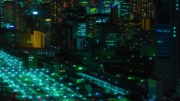 Un lapso de tiempo nocturno de vista panorámica en la ciudad urbana de Tokio de gran angular de tiro largo — Vídeos de Stock