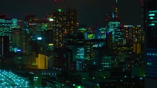 En natt timelapse av panoramautsikt över staden i Tokyo hög vinkel långsökt — Stockvideo