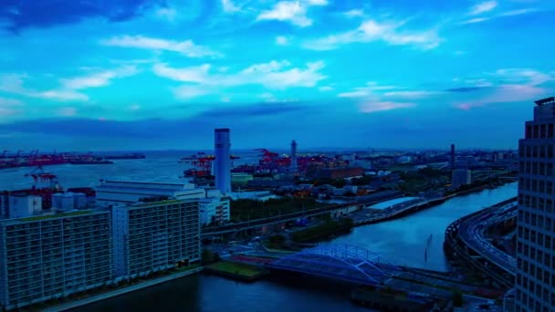 A sunset timelapse of cityscape near the bay area in Shinagawa Tokyo wide shot panning — 비디오