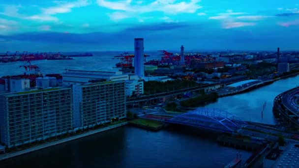 A sunset timelapse of cityscape near the bay area in Shinagawa Tokyo wide shot zoom — 비디오