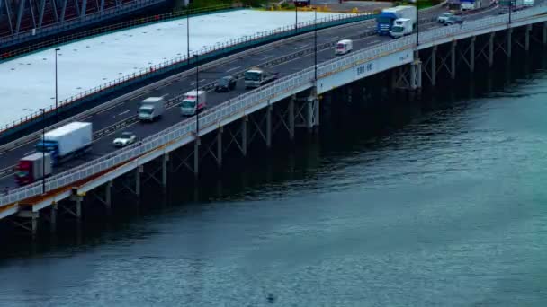 A timelapse of city street near the river in Shinagawa Tokyo high angle long shot panning — Stock Video