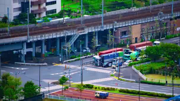 A timelapse of city street near the river in Shinagawa Tokyo high angle long shot zoom — 비디오