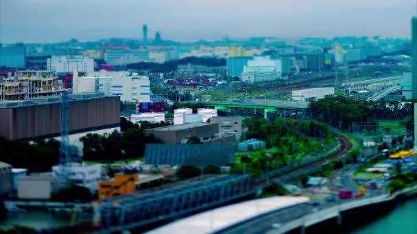 A timelapse of city street near the river in Shinagawa Tokyo high angle tiltshift tilting — 비디오