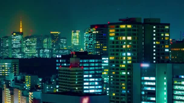 A night timelapse of cityscape at the urban city in Tokyo long shot tilt — Stock Video