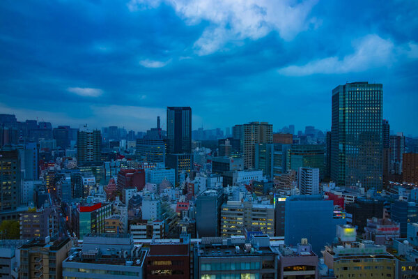 A dawn urban cityscape wide shot. Bunkyo district Suidobashi Tokyo / Japan - 11.11.2019